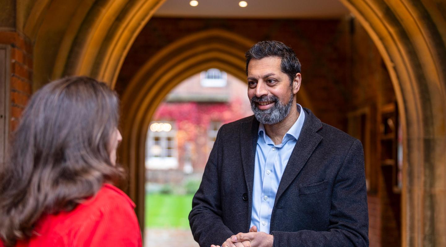 The Bursar stood chatting to the Headmaster at Winchester College