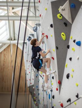 boy on indoor climbing wall